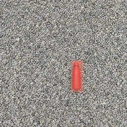 The bottle and its shadow covered by a coral removal mask